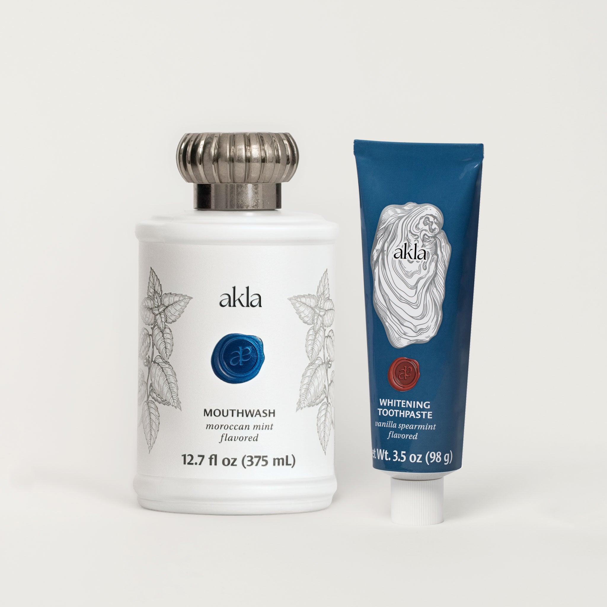 Akla oral care duo – fluoride-free Moroccan Mint Mouthwash and Vanilla Spearmint Whitening Toothpaste in design-forward, recyclable packaging.