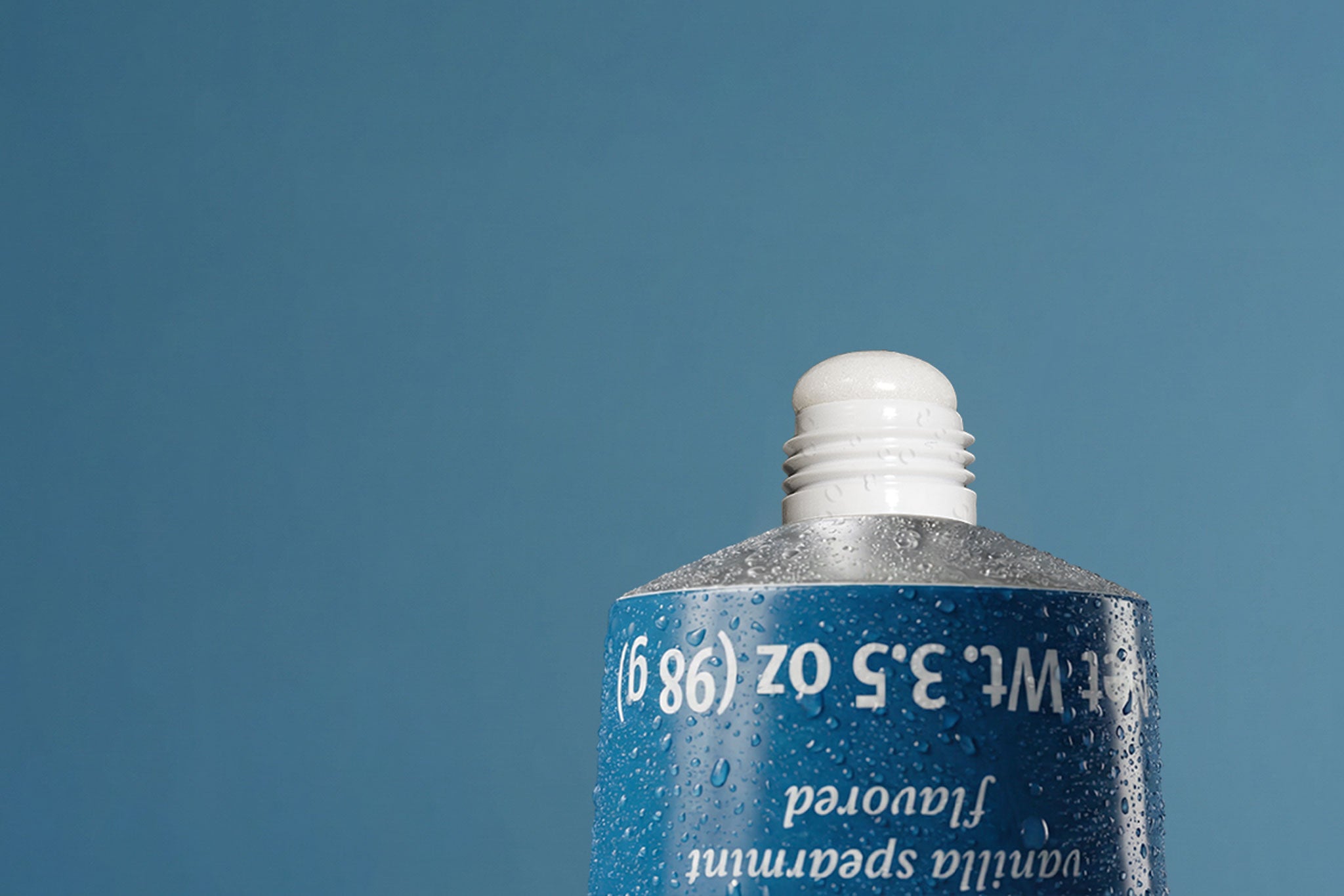 Closeup of Akla's nano-hydroxyapatite toothpaste with squeezed out paste containing 5% n-hap and pearl powder.