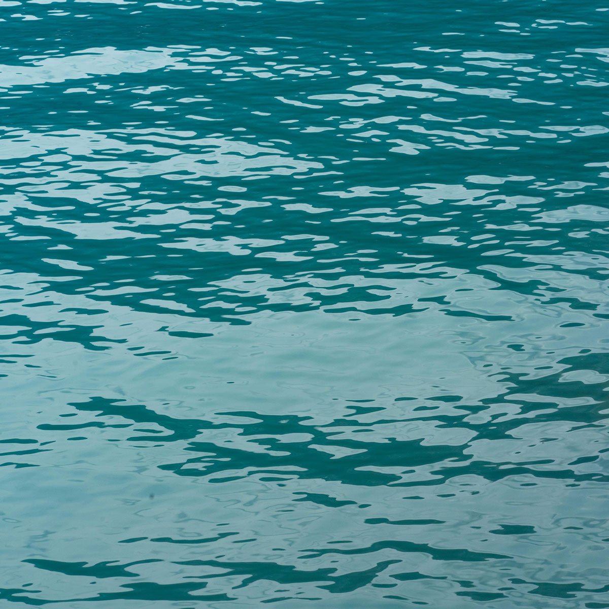 Close-up of Swiss water ripples symbolizing purity and precision in Akla fluoride-free oral care.