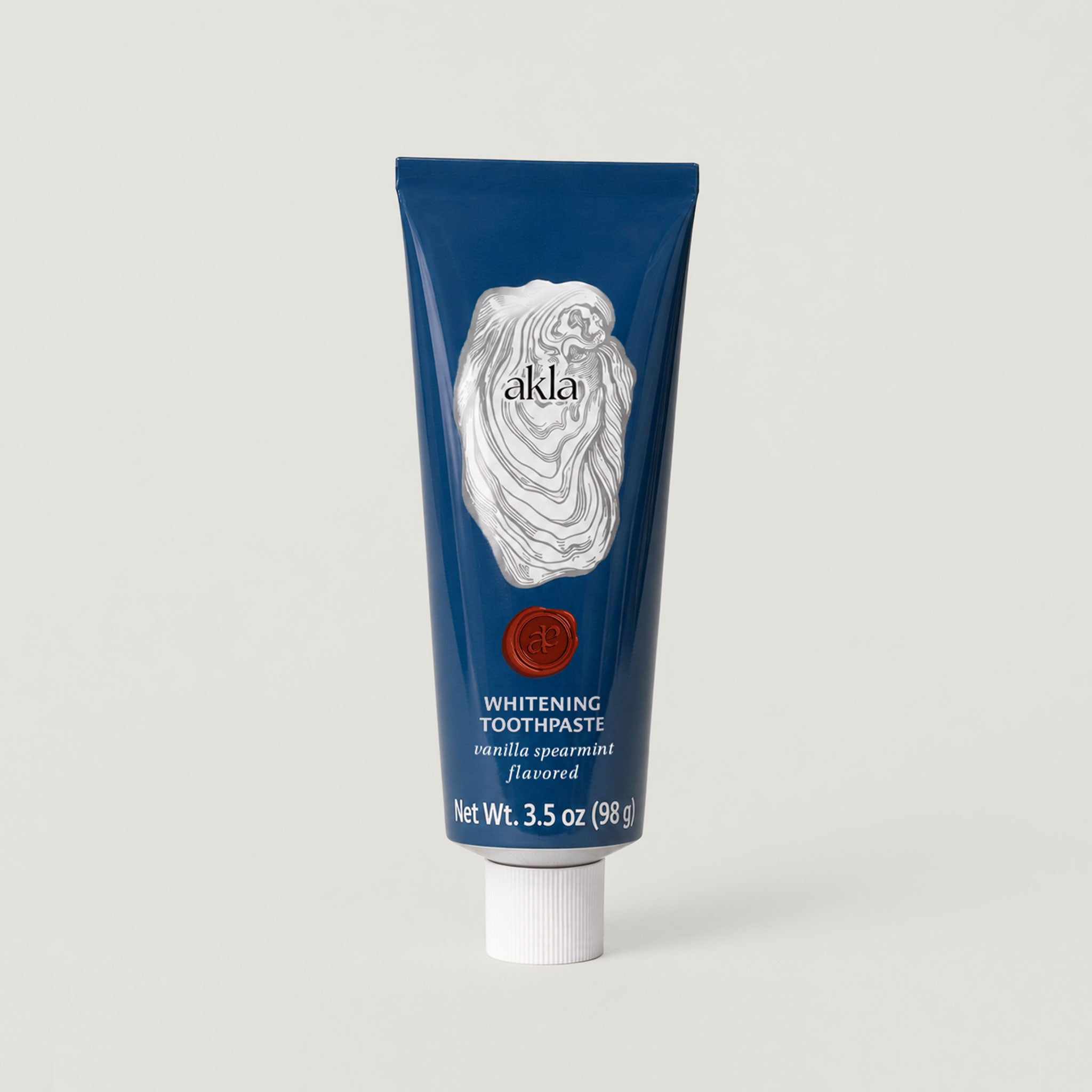 Akla hydroxyapatite whitening toothpaste in a blue aluminium tube, fluoride-free, vanilla spearmint, Swiss-made.
